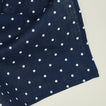 Detailed view of Dot linen napkin in navy and white