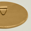 Close up view of round brass mirror.