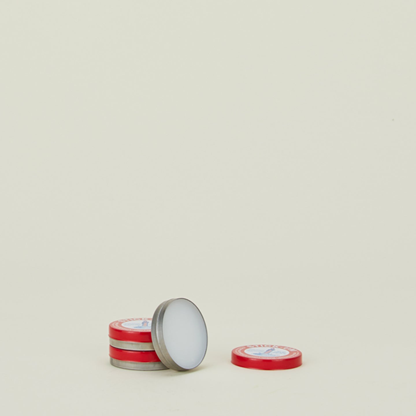 3 containers of Stick-um candle adhesive