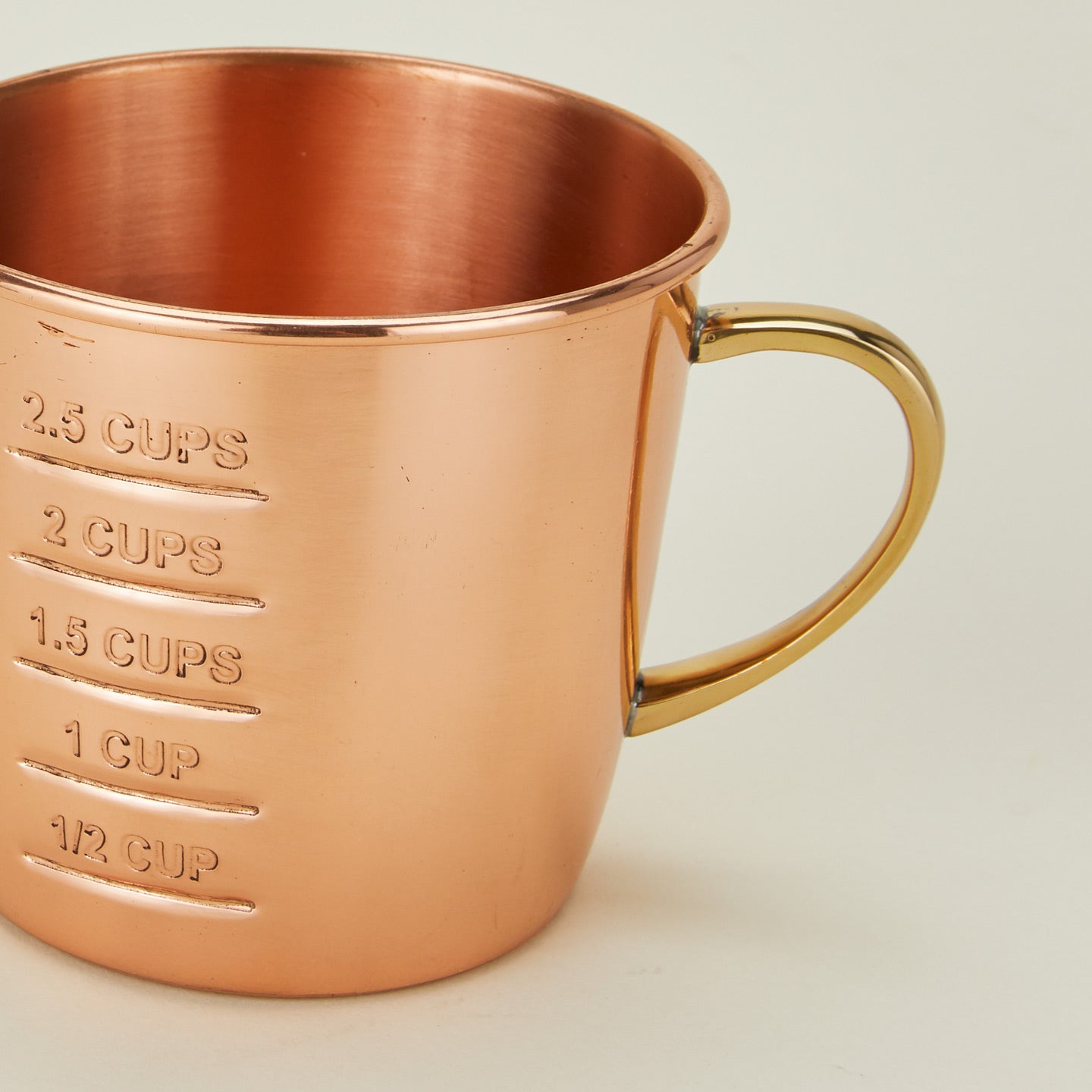 Detailed view of Copper liquid measuring cup