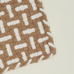 Detail view of parquet potholder in flax and white