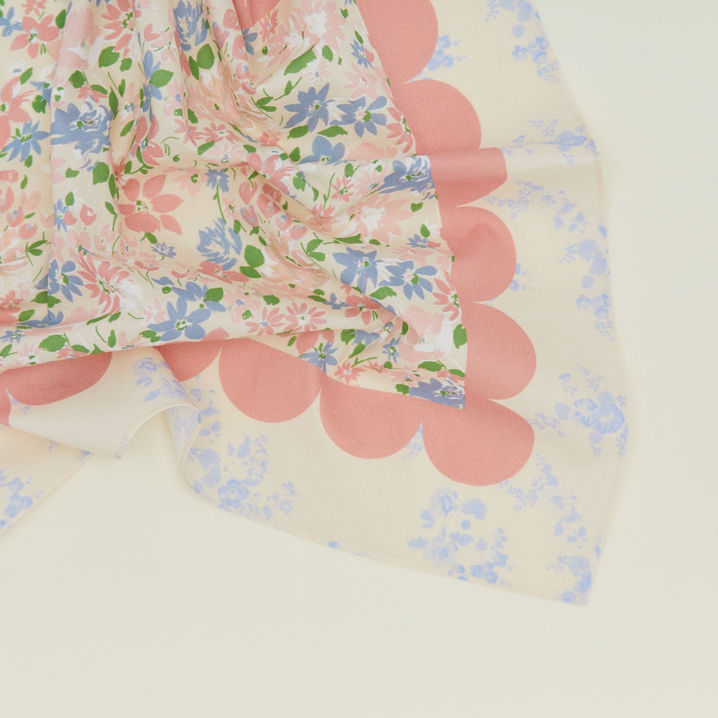 A close up of a mixed floral napkin with a rose pattern.