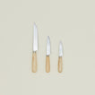 An overhead of three knives with wood handles in varying sizes.