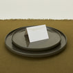 Foil pressed placecard lights on plate with a runner