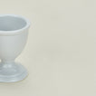 Detailed view of traditional porcelain egg cup in white