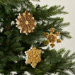 Quilled snowflake ornaments in neutral on tree