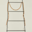 Natural wood beaded garland on ladder