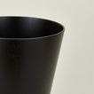 Close up view of wooden waste basket in dark
