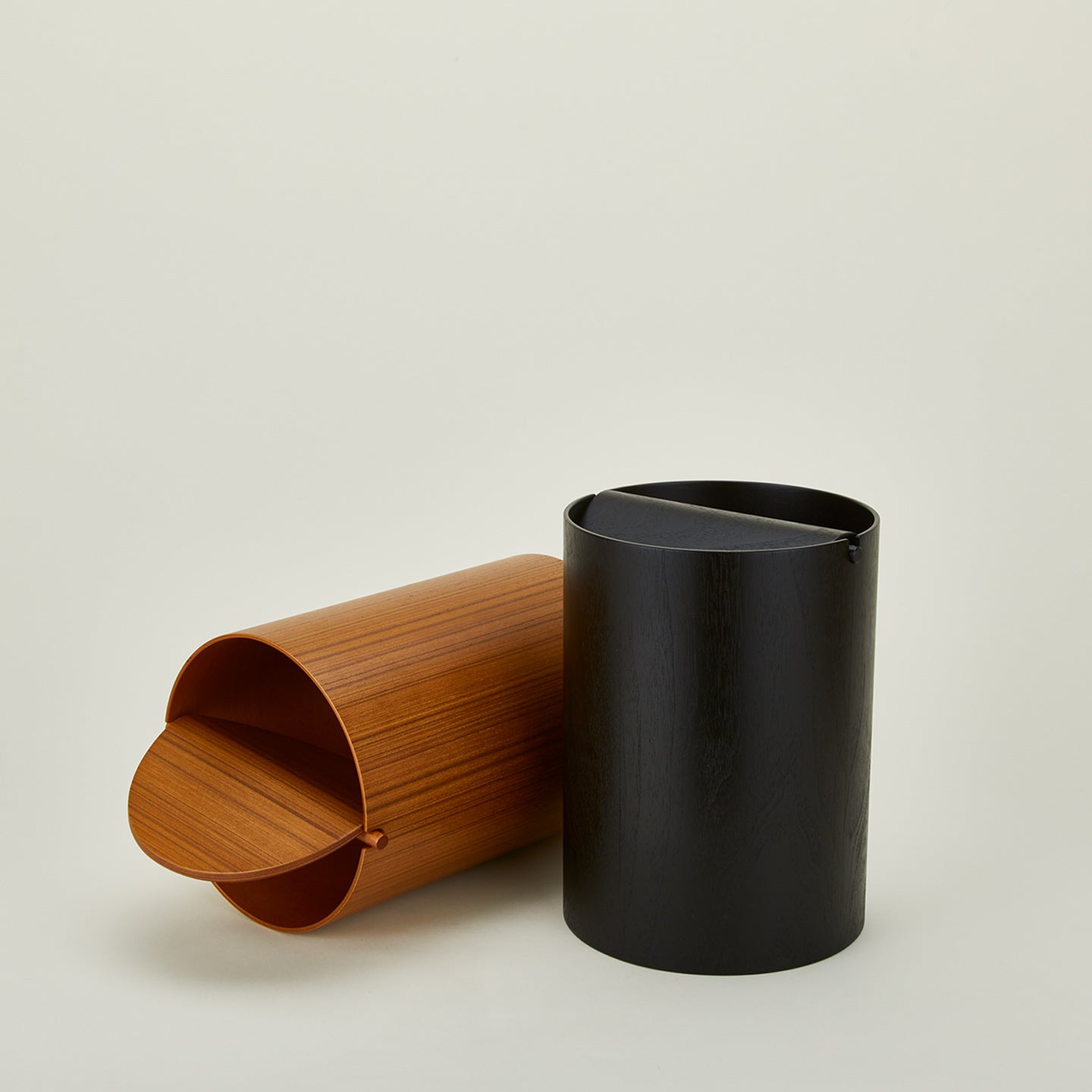 Lidded wooden waste baskets in various colors