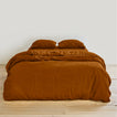 Simple linen bedding in terracotta