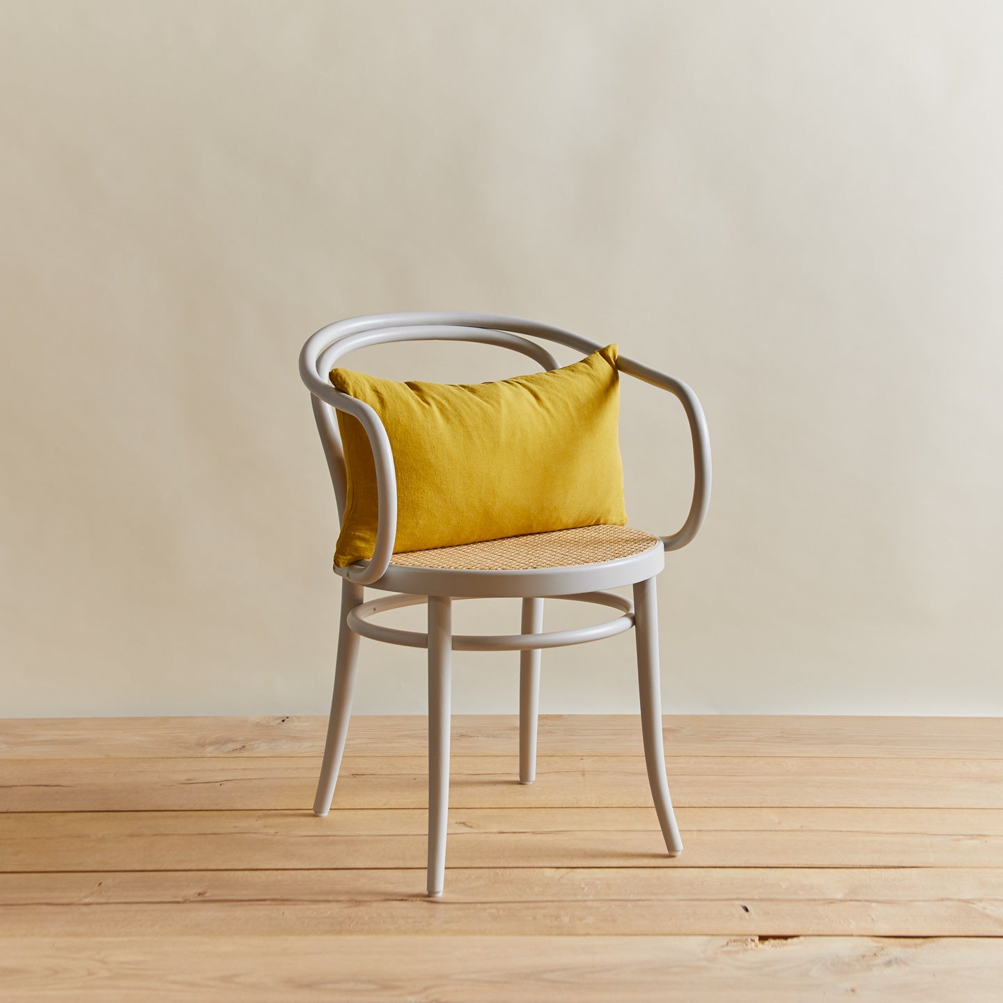 Simple linen pillow in mustard