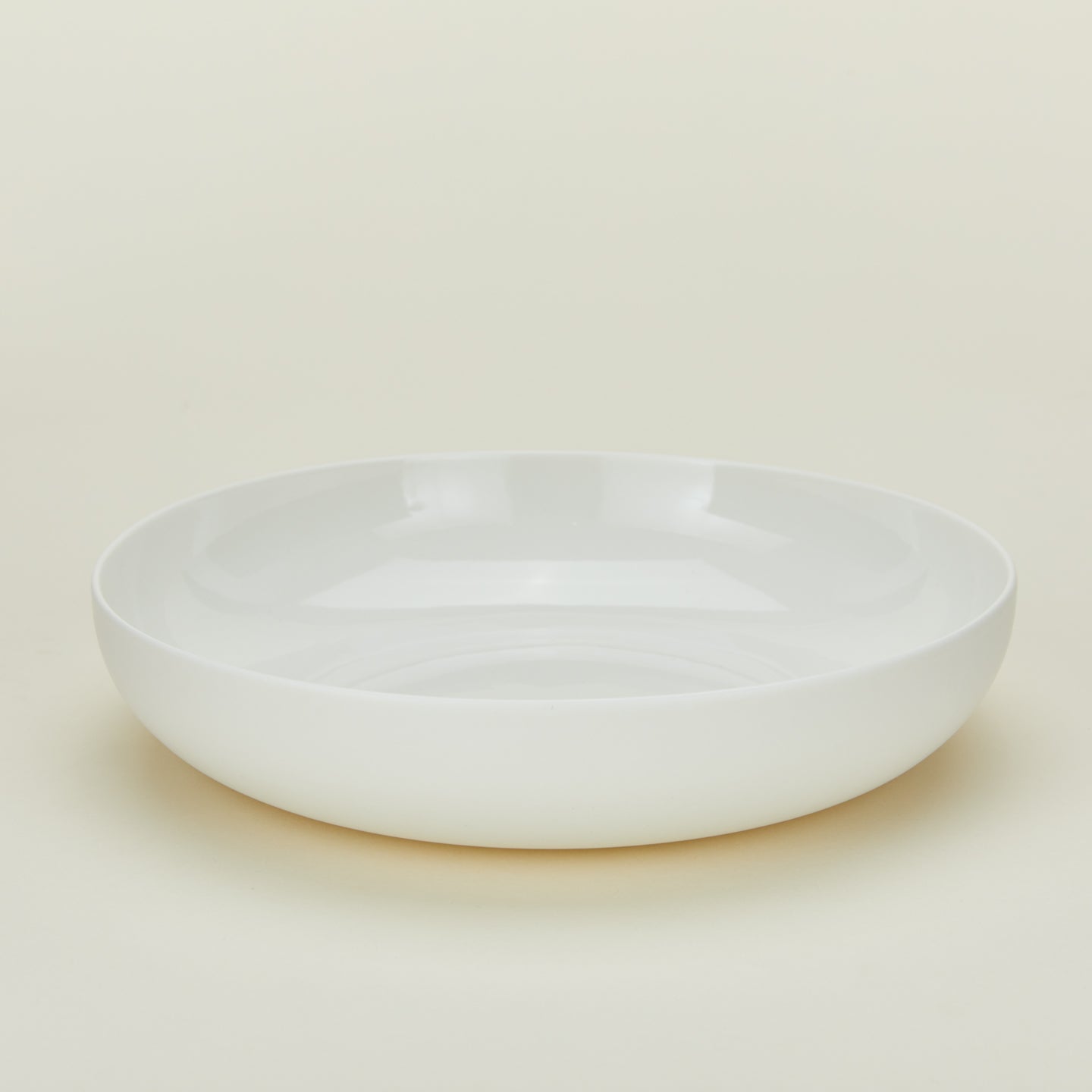 Simple porcelain low bowl in white