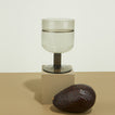 Simple Seeded Glass in Smoke on cube with avocado.