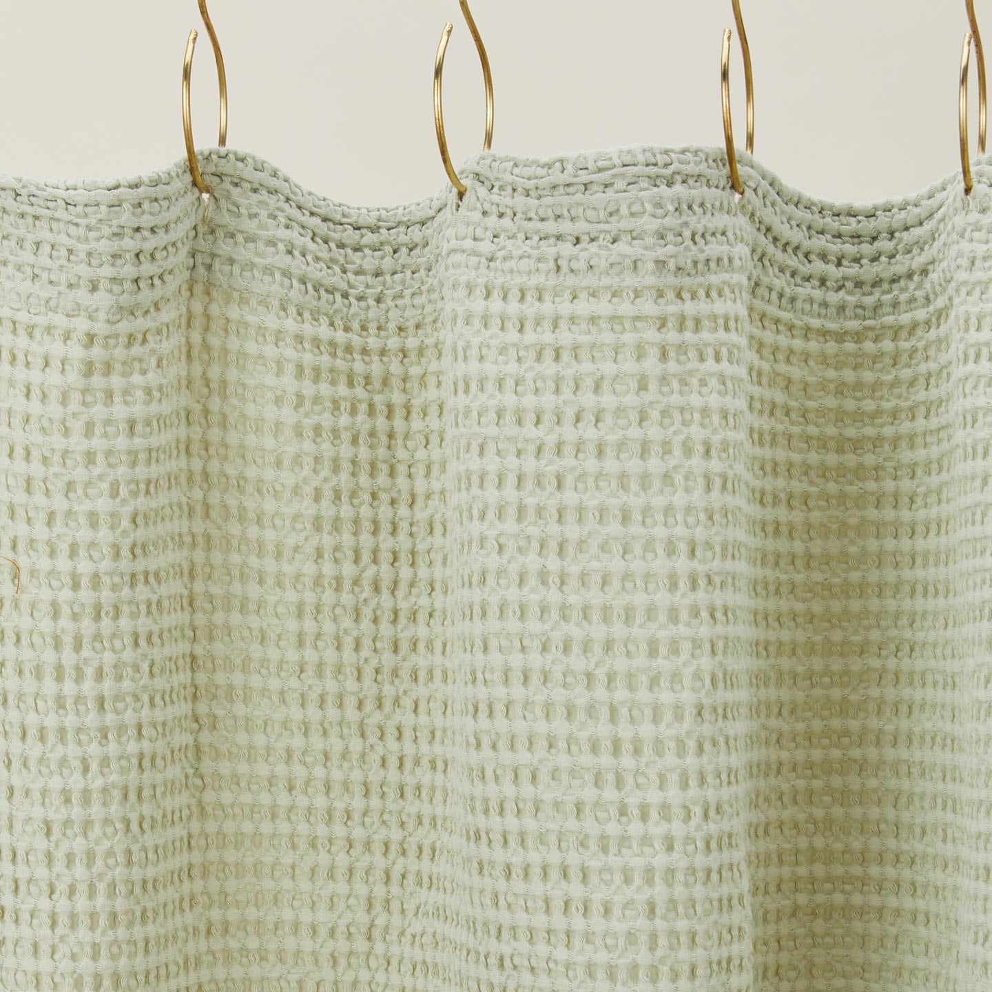 Simple waffle shower curtain in sage.