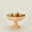 Splatterware footed bowl in ivory and bronze with pears