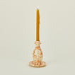 Large splatterware candlestick holder in ivory and bronze with candle
