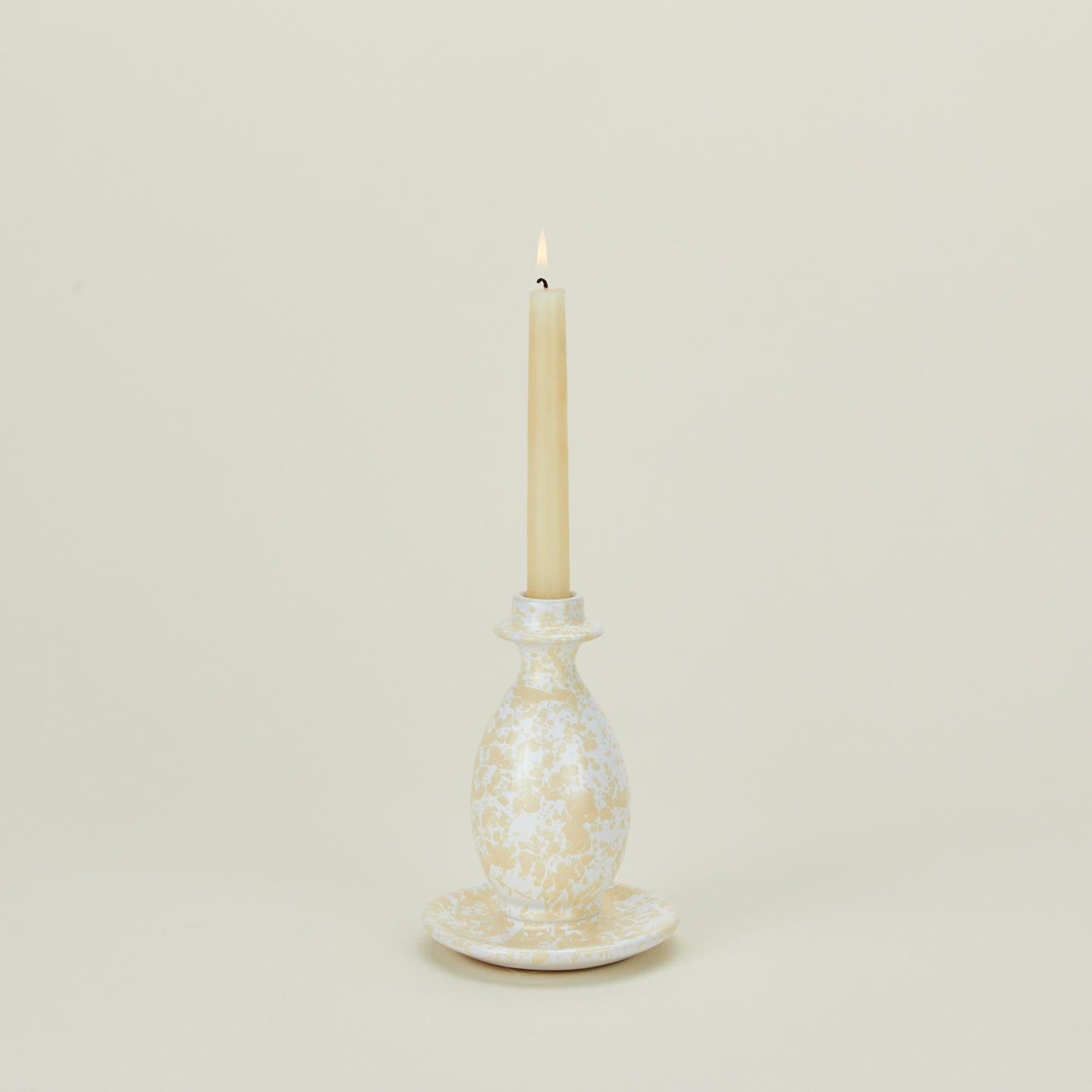 Large candlestick holder in white and ivory with candle