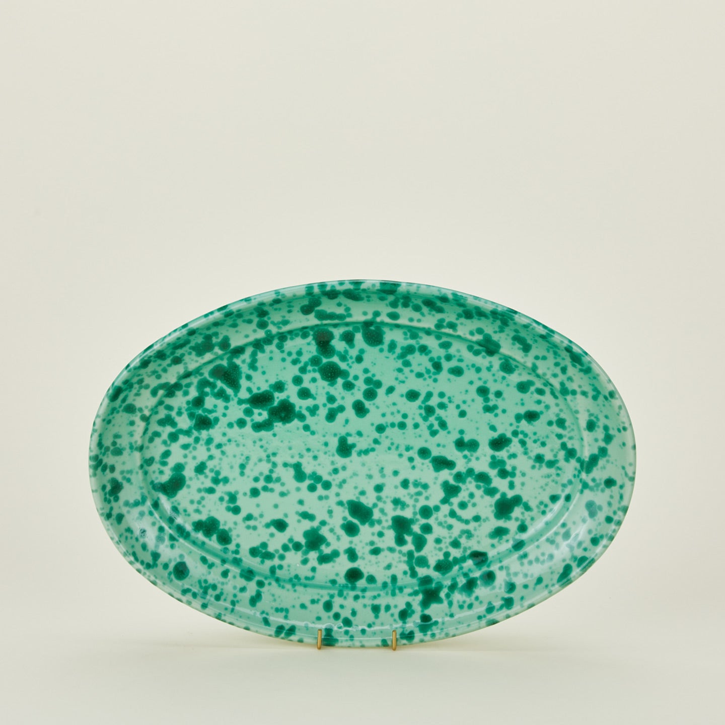 Splatterware serving platter in sage and green