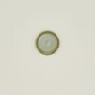 An overhead of an olive stoneware spoon rest.