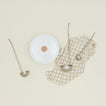 The collective forged pewter ladle set of three with dutch oven and checked kitchen towel