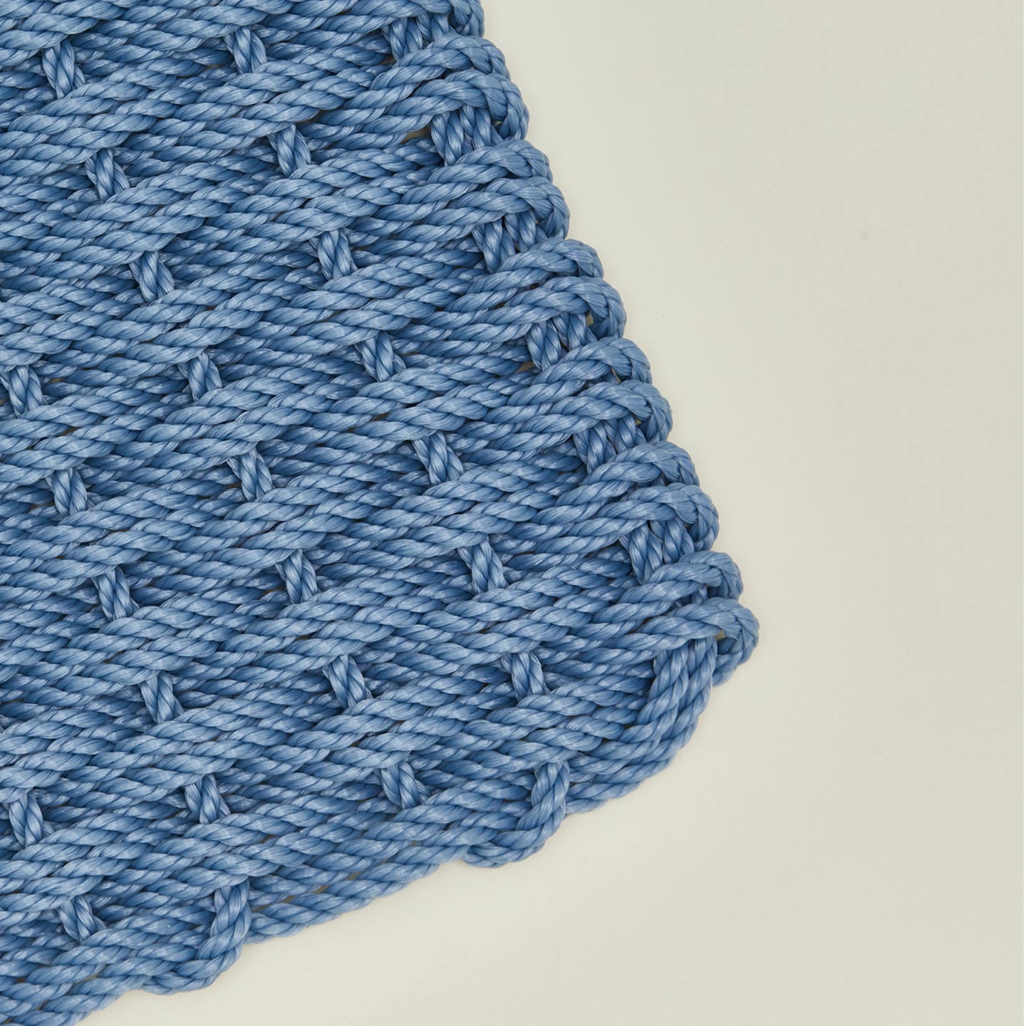 Close up view of woven doormat in sky