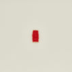 Tinsel ribbon in red on neutral background