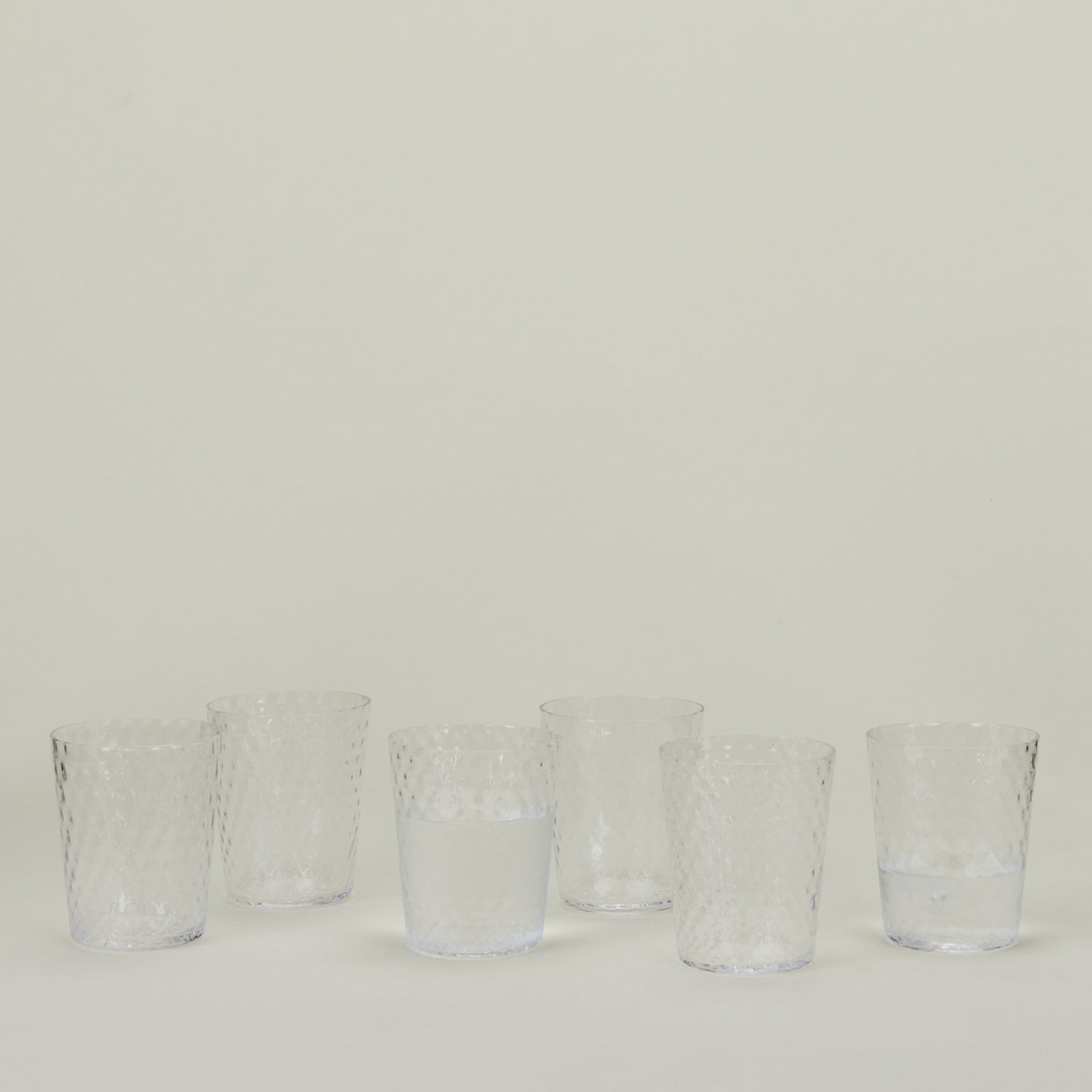 Set of 6 Veneziano Tumblers in Clear, with water.