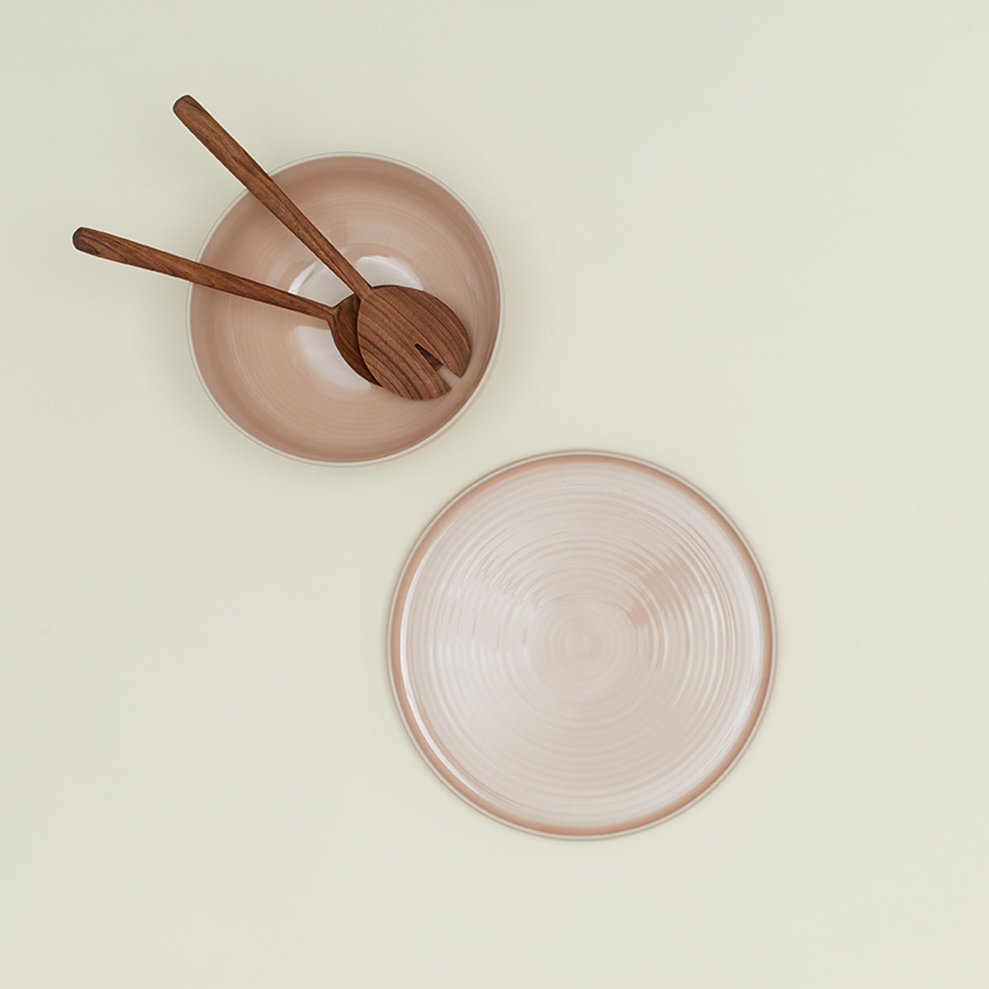 Essential Serving Platter and Serving Platter in Blush, with wood serving utensils.