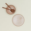 Essential Serving Bowl and Serving Platter in Blush, with wood serving utensils.