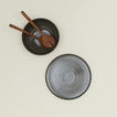 Essential Serving Platter and Serving Platter in Olive, with wood serving utensils.